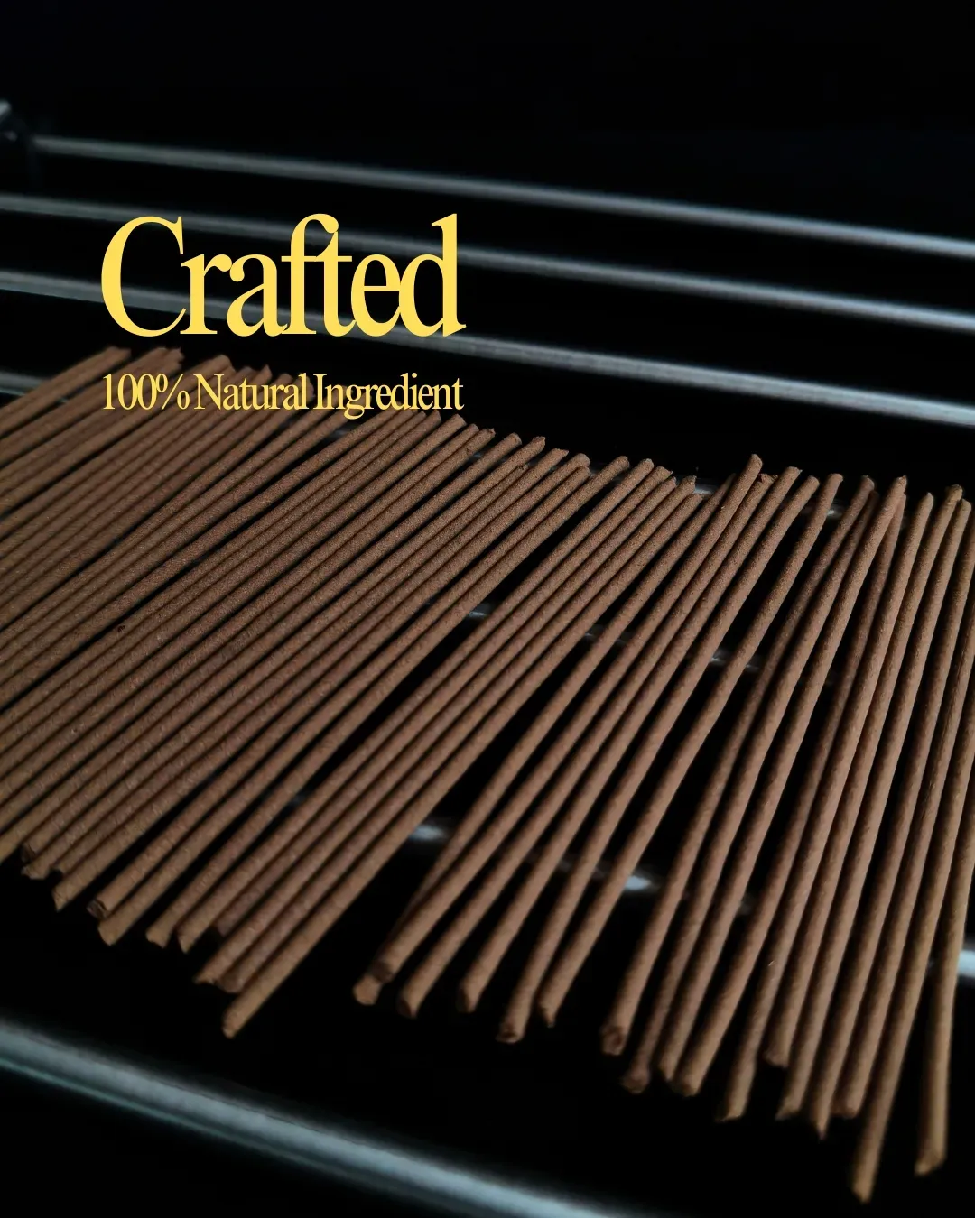 Hand-rolled moodé incense sticks drying on a rack